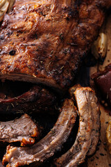 American cuisine concept. Grilled pork ribs with grilled sauce. American bbq ribs closeup. wood Dark background.