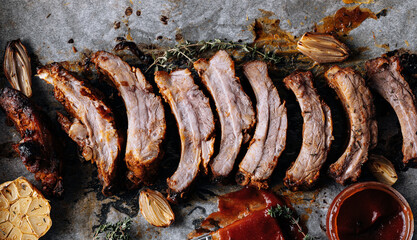 American cuisine concept. Grilled pork ribs with grilled sauce. American bbq ribs closeup. wood Dark background.