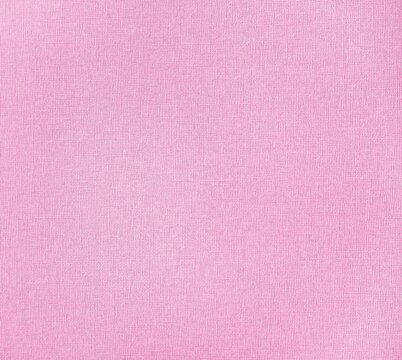 Texture of a pastel pink linen paper as a background