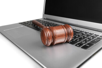 Classic brown justice wooden hammer on laptop