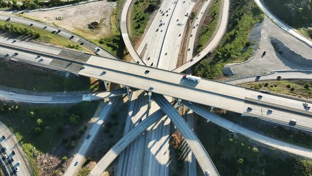 Drone 4k. Aerial view Los Angeles. Intersection of highway freeway roads in LA. California commute drive in urban modern city in America.
