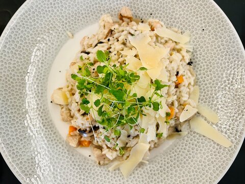 Close-up overhead view of a bowl of mushroom and parmesan risotto