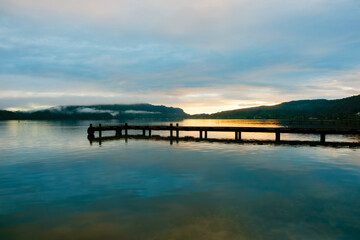Fototapeta na wymiar Pier on Lake Taupo on calm morning at sunrise