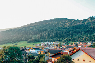 Naklejka na ściany i meble Small Austrian town with mountain view, Innsbruck, Austria 