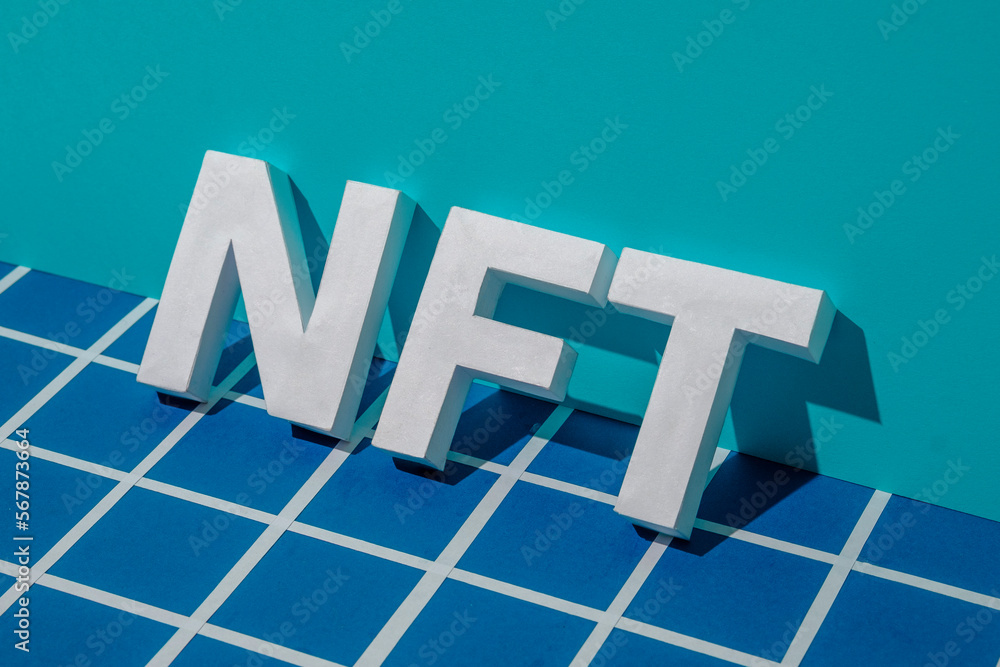 Poster nft letters and shadow on a blue background with a gridded pixel in cyberspace. minimal concept of i