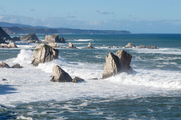 playa del silencio in asturias a sunny day with waves and high tide