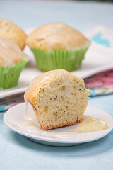 Lemon poppy cupcakes on a light background.