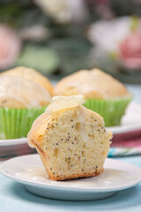 Lemon poppy cupcakes on a light background.