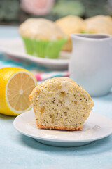 Lemon poppy cupcakes on a light background.