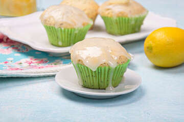 Lemon poppy cupcakes on a light background.
