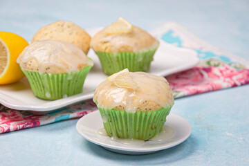 Lemon poppy cupcakes on a light background.
