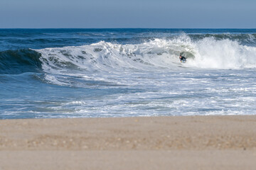 Bodyboarder surfing ocean wave