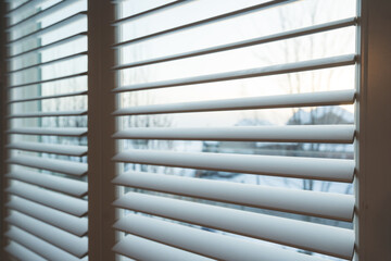 close up of an open window with shutters