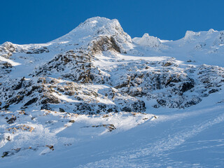 Fototapeta premium snow covered mountains in winter in a see of fog, fagaras mountains from near balea lake, romania 
