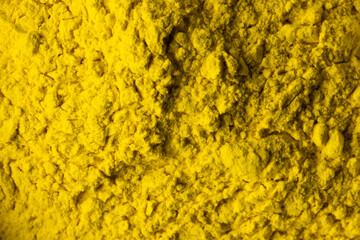 Naklejka premium Close up of yellow powder background, with copy space