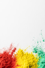 Close up of multi coloured powder and copy space on white background