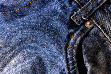 Close up of material of pair of blue jeans