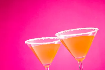  Glasses with cocktail and sugar over neon pink background © vectorfusionart