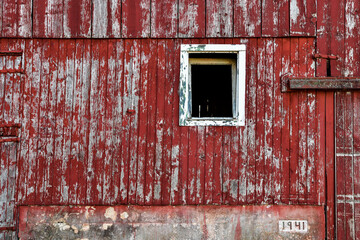Weathered and worn barn wood and broken windows