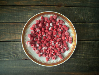 frozen raspberries on a plate.