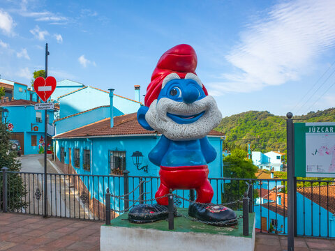 Andalucia. Spain- Juzcar in uplands of Andalucia. Chosen to be the set of the Smurf movie, the small village has kept the blue paint look and murals to attract tourists. 