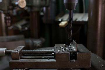 Part machining with drilling machine