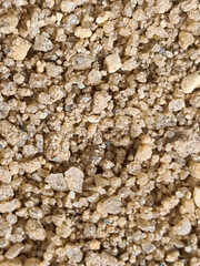 Texture in raw sand, brown.