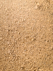 Texture in raw sand, brown.