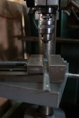 Part machining with drilling machine