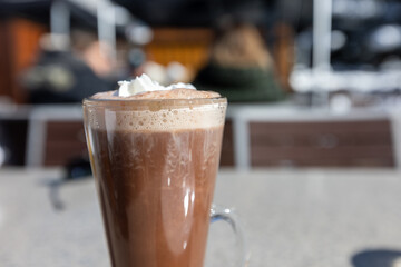 Beautiful Hot Chocolate in Tall Clear Glass on Patio