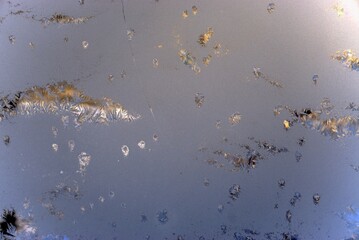 Beautiful frost pattern on the glass window .