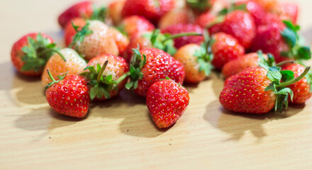 Strawberries on a wooden table. Selective focus. Shallow depth of field.