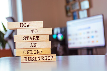Wooden blocks with words 'How To Start An Online Business?'.