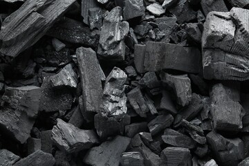 Heap of coal as background, top view