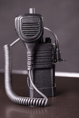 single industry standard radio unit with accessory speaker microphone. two-way walkie-talkies with handheld controller.