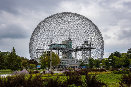 Montreal, Quebec, Canada, August 27, 2022: Montreal's famous geodesic dome, the Biosphere, seen in a grey day, at St. Helen's Island.