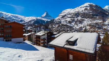 View of famous Swiss Alps ski resort,Matterhorn snow mountain peak in background.Winter travel and...