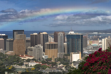 Fototapeta na wymiar Rainbow over downtown Honolulu from Punchbowl National Cemetery; Honolulu, Hawaii