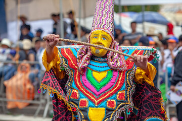Fototapeta na wymiar Carnival of Cajamarca, parade of multicolored and traditional costumes. Cajamarca, Peru.
