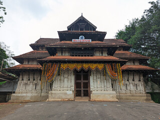 entrance of a historical temple of worship for hindus in kerala in the daytime