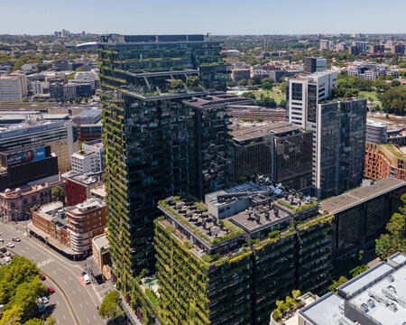 Aerial drone view of Central Park in Chippendale, Sydney, New South Wales, Australia showing the building with its vertical hanging gardens and cantilevered heliostat  