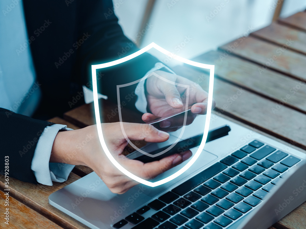 Poster secure payment concept. the large shield icon glowing while business people using mobile smart phone