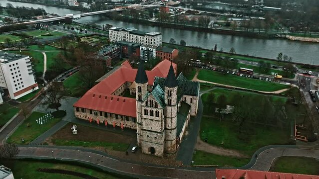 Drone shot revealing Kloster church (Klosterkirche) near Kunstmuseum Magdeburg - Kloster Unser Lieben Frauen (Kunstmuseum Magdeburg - Monastery Of Our Lady) , Magdeburg, Germany