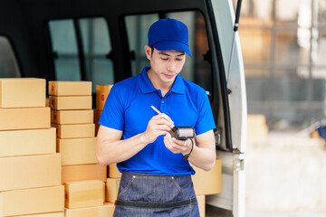 Delivery man asia people checking portable delivery device with parcel box to customer home address. holding EDC machine, contactless, cashless