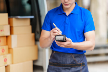 Delivery man asia people checking portable delivery device with parcel box to customer home address. holding EDC machine, contactless, cashless