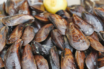 Thai mussels in metal on table top view 