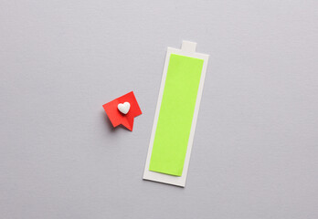 Paper cut full battery level with Social media like on gray background