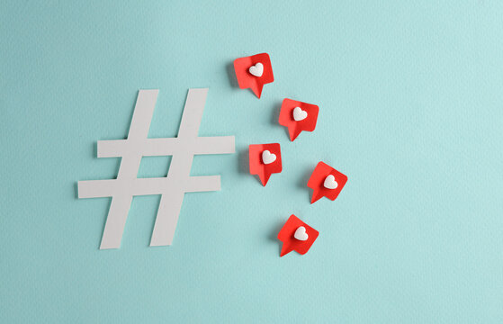Hashtag with social media likes on blue background. Creative minimal layout