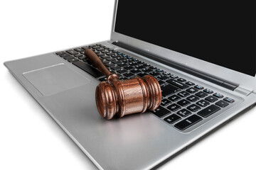 Classic brown justice wooden hammer on laptop