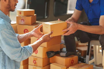 Delivery man asia people checking portable delivery device with parcel box to customer home address. © M+Isolation+Photo